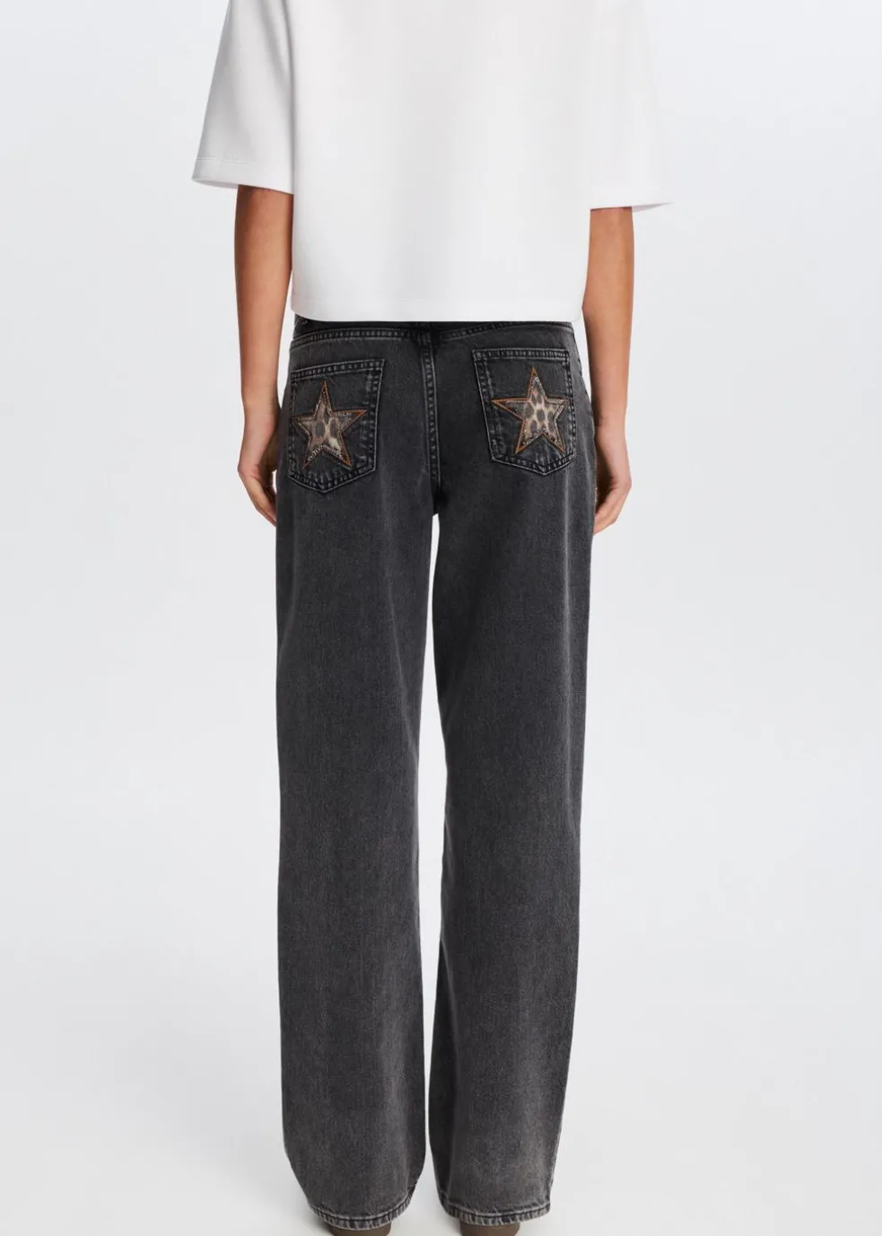 Jeans met sterren achterzakken
